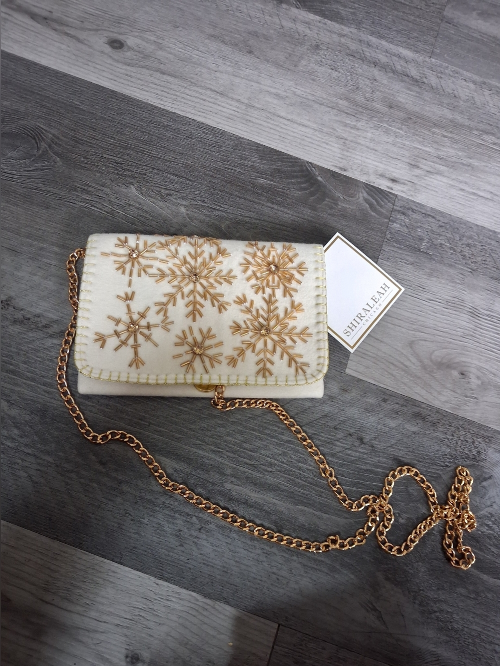 Shiraleah Cream Crossbody with Gold Snowflake Embellishments